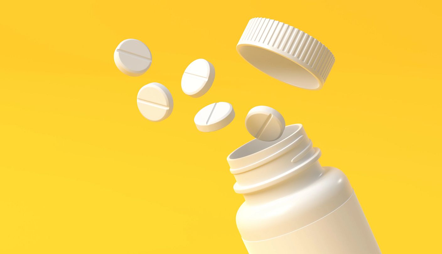 Don’t Start Aspirin Regimen to Prevent Heart Attack a bottle of pills on a yellow background