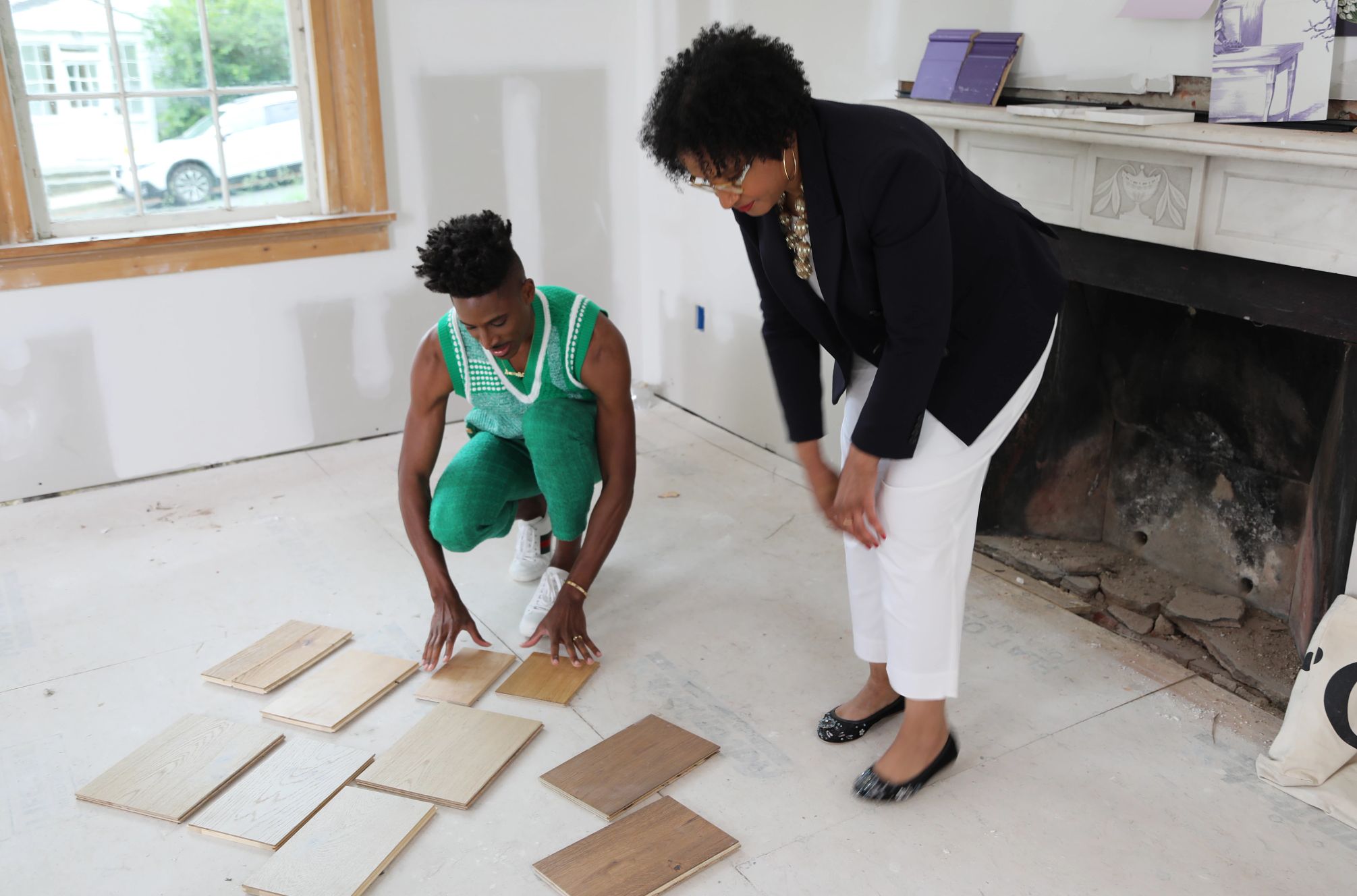 Robert Hartwell and Courtney McLeod comparing flooring samples in Breaking New Ground