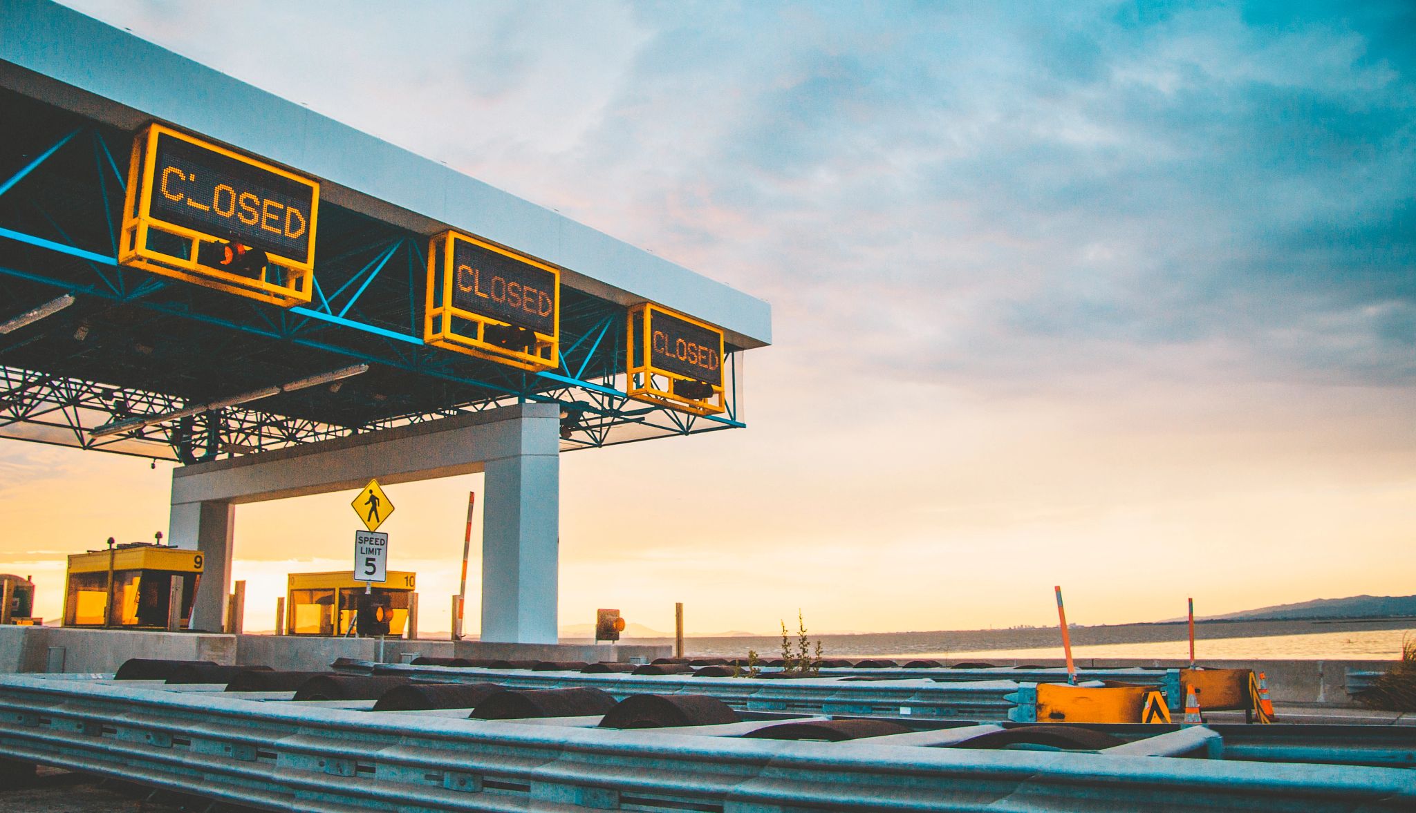 What Do You Know About Toll Road Scams? a highway toll plaza without any cars