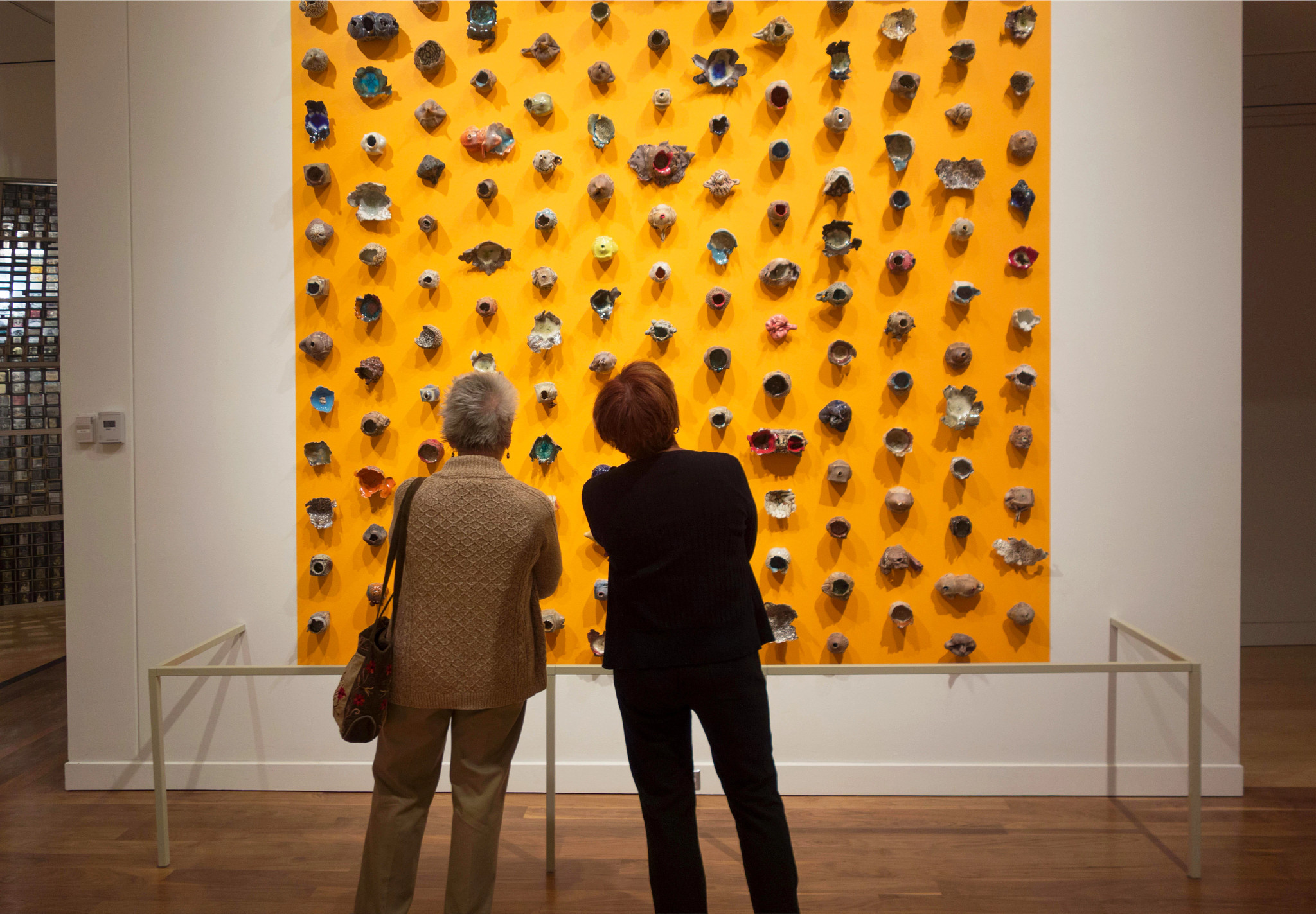 two people admire a work of art