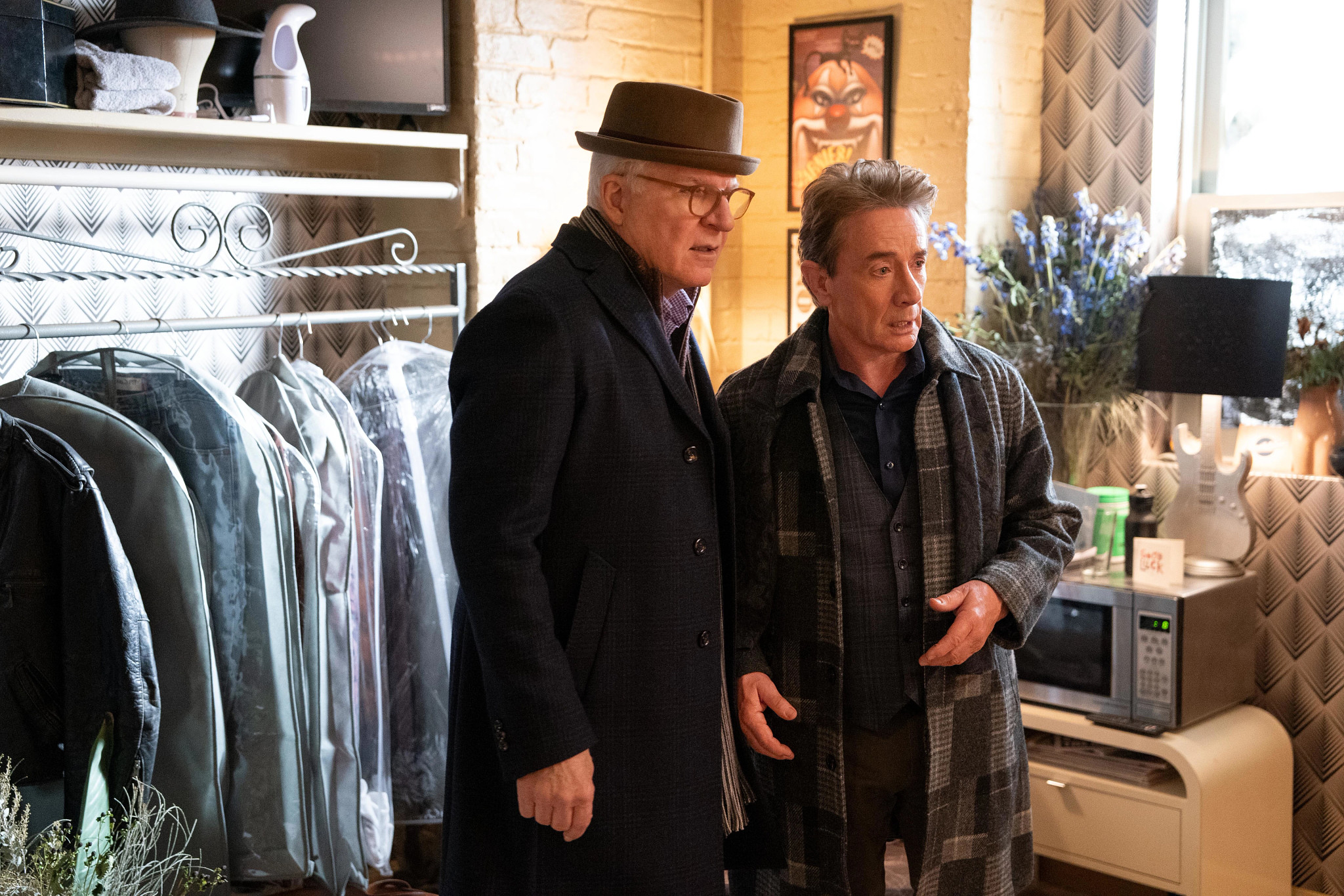 Steve Martin and Martin Short both with shocked looks on their faces in the Hulu series Only Murders in the Building