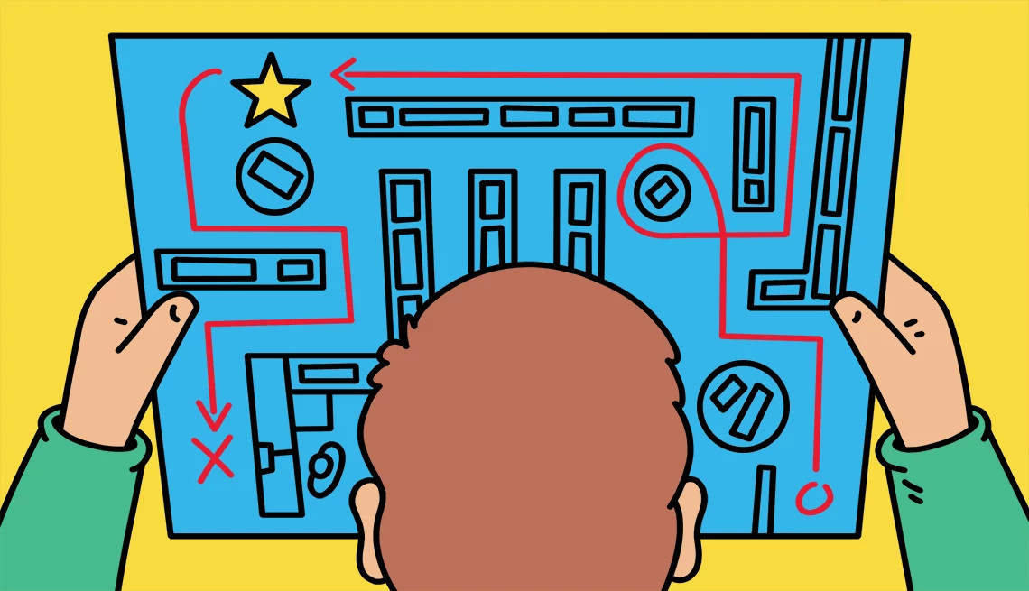 a person holds up a blueprint of a store