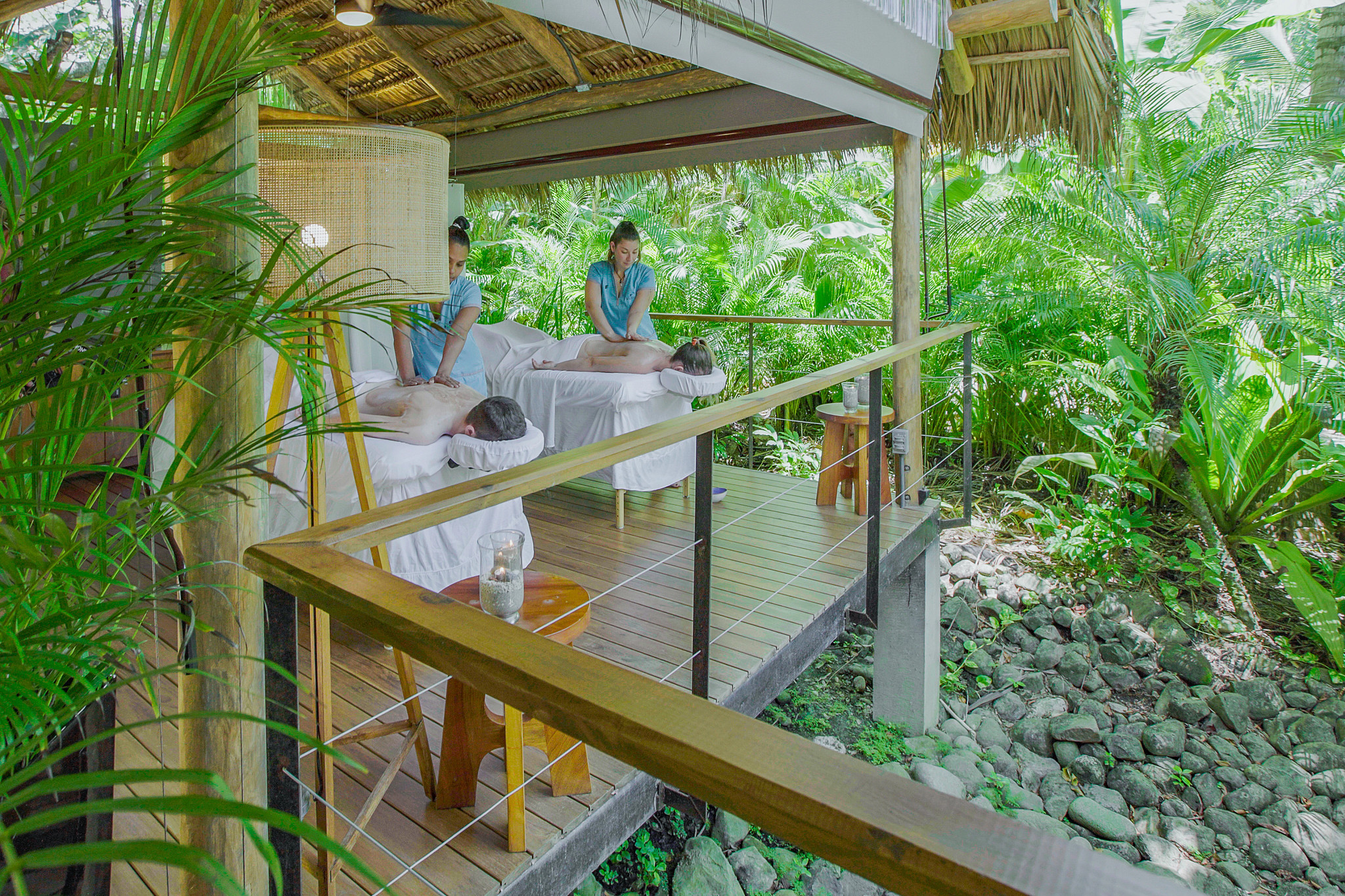 people getting massages outdoors at a resort 