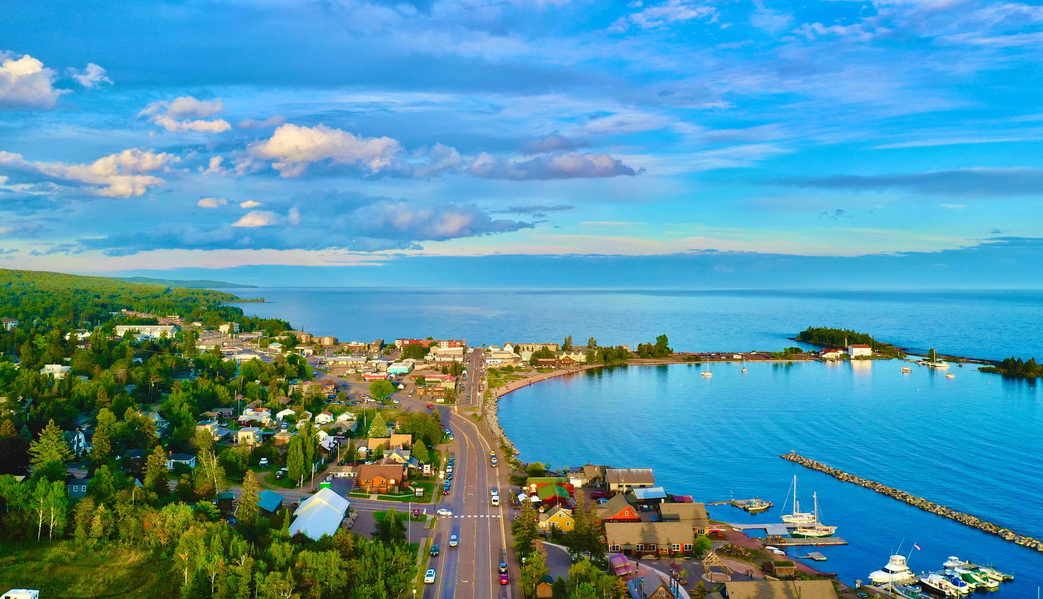 Lake Superior in Grand Marais, MN Overhead view of lake with boats on it and houses along it