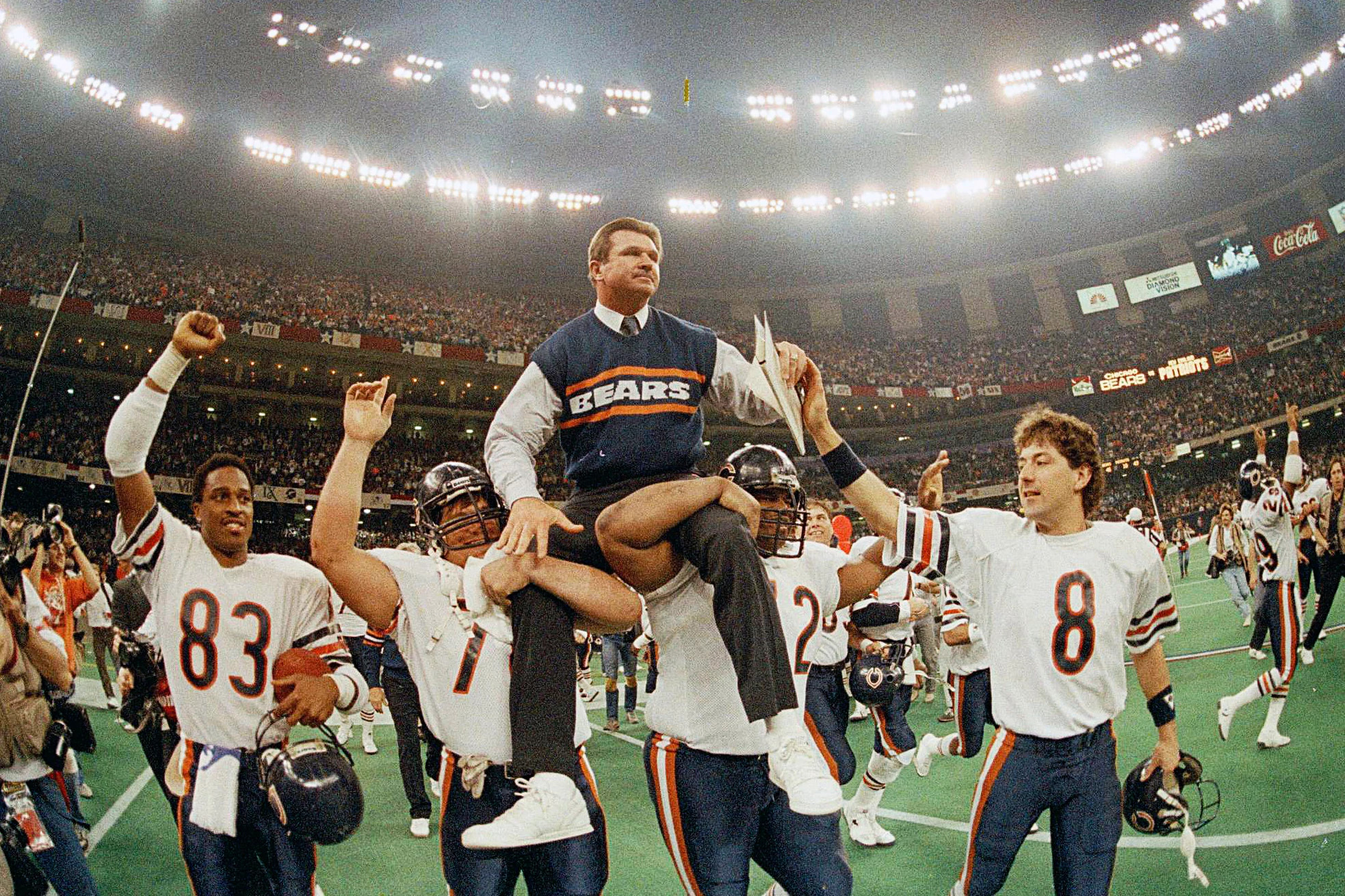 mike ditka being carried on his player's shoulders after winning super bowl 20