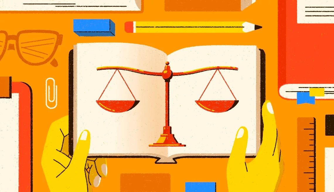 Becoming a Paralegal After 50 an illustration of a person's hands holding a book with the scales of justice