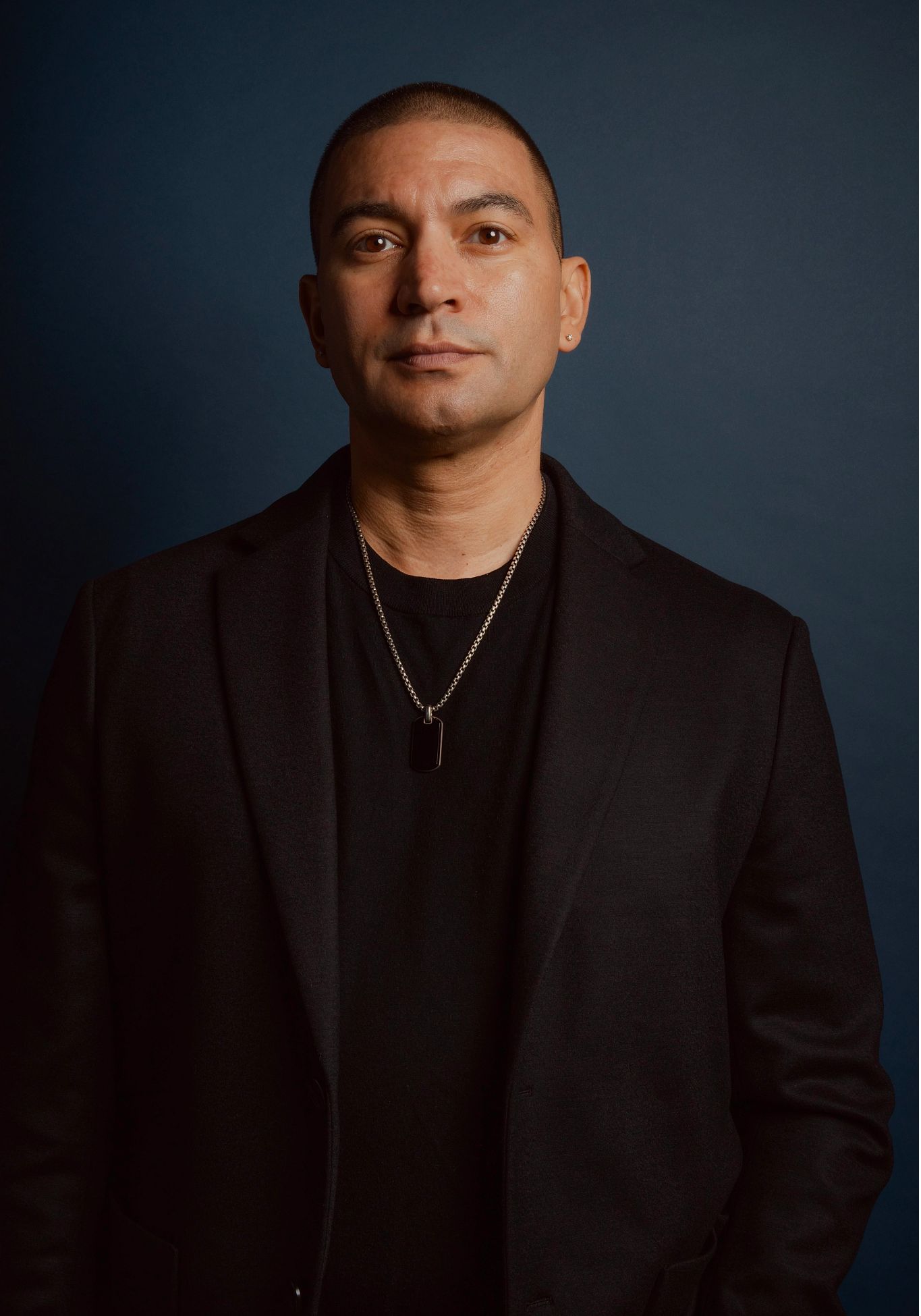 Poetry for People Who (Think They) Don’t Like Poetry Adrian Matejka posing for a portrait in a black jacket and shirt