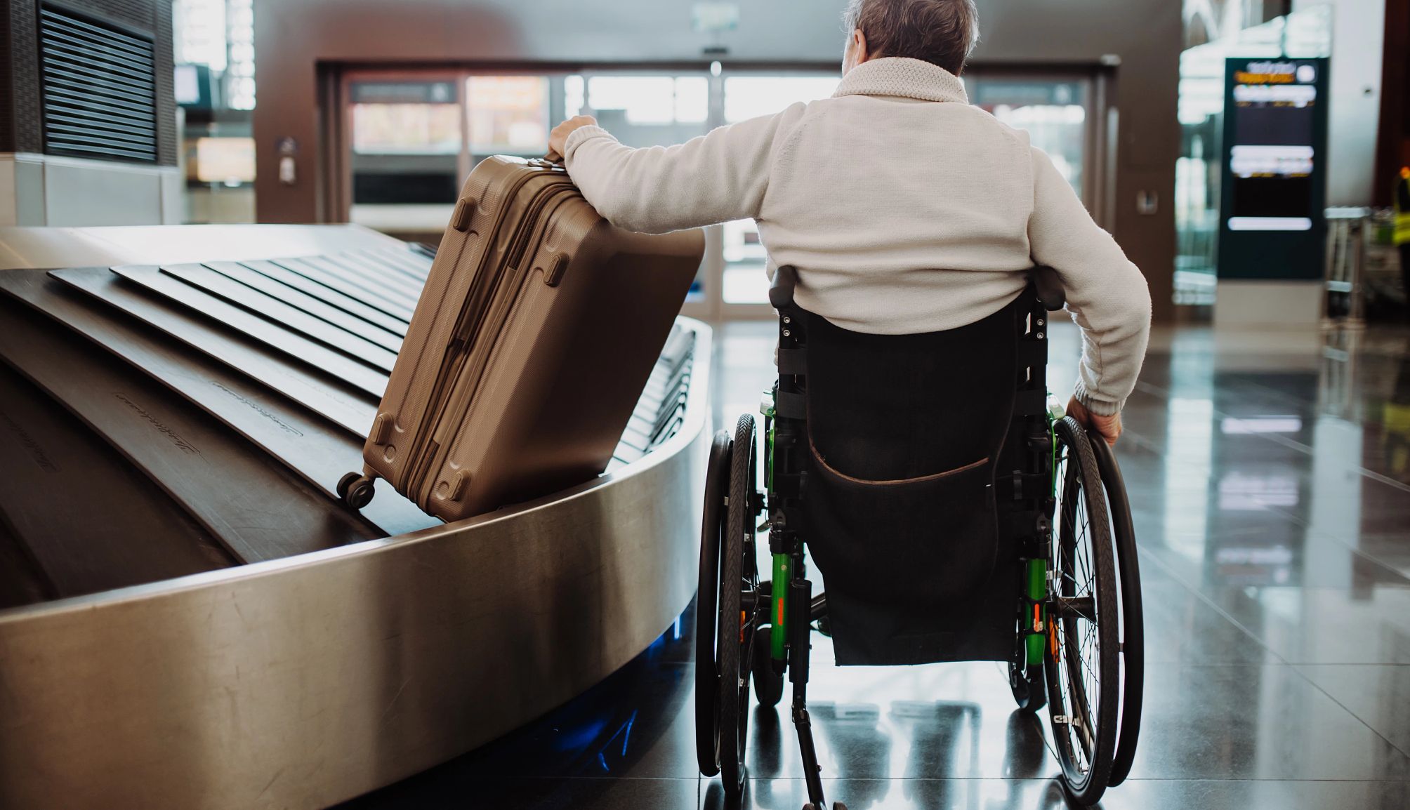 New action to make air travel easier for people in wheelchairs photo of a man in a wheelchair in an airport