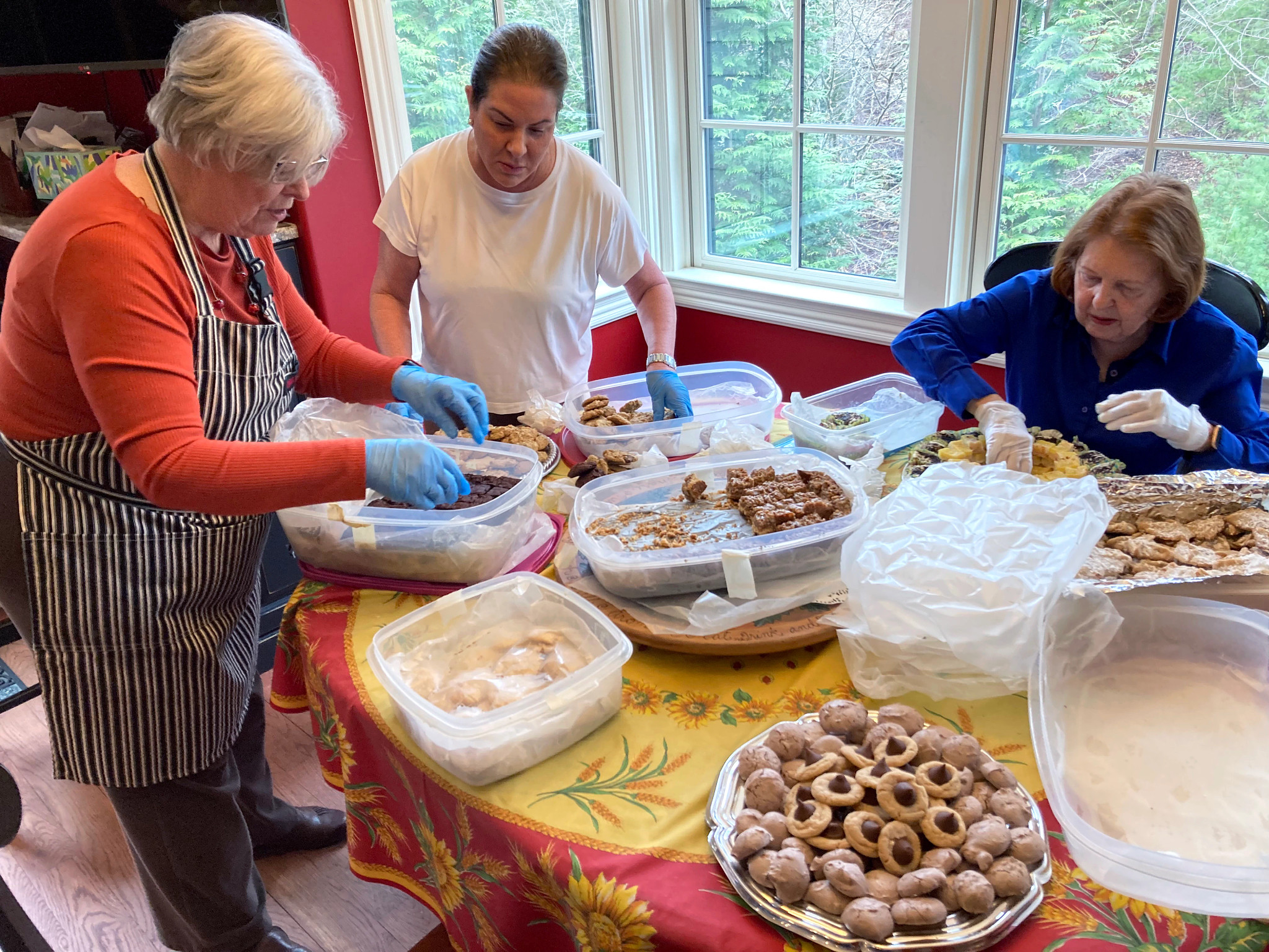 Barbara Beckerman and friends put various baked goods in tupperware