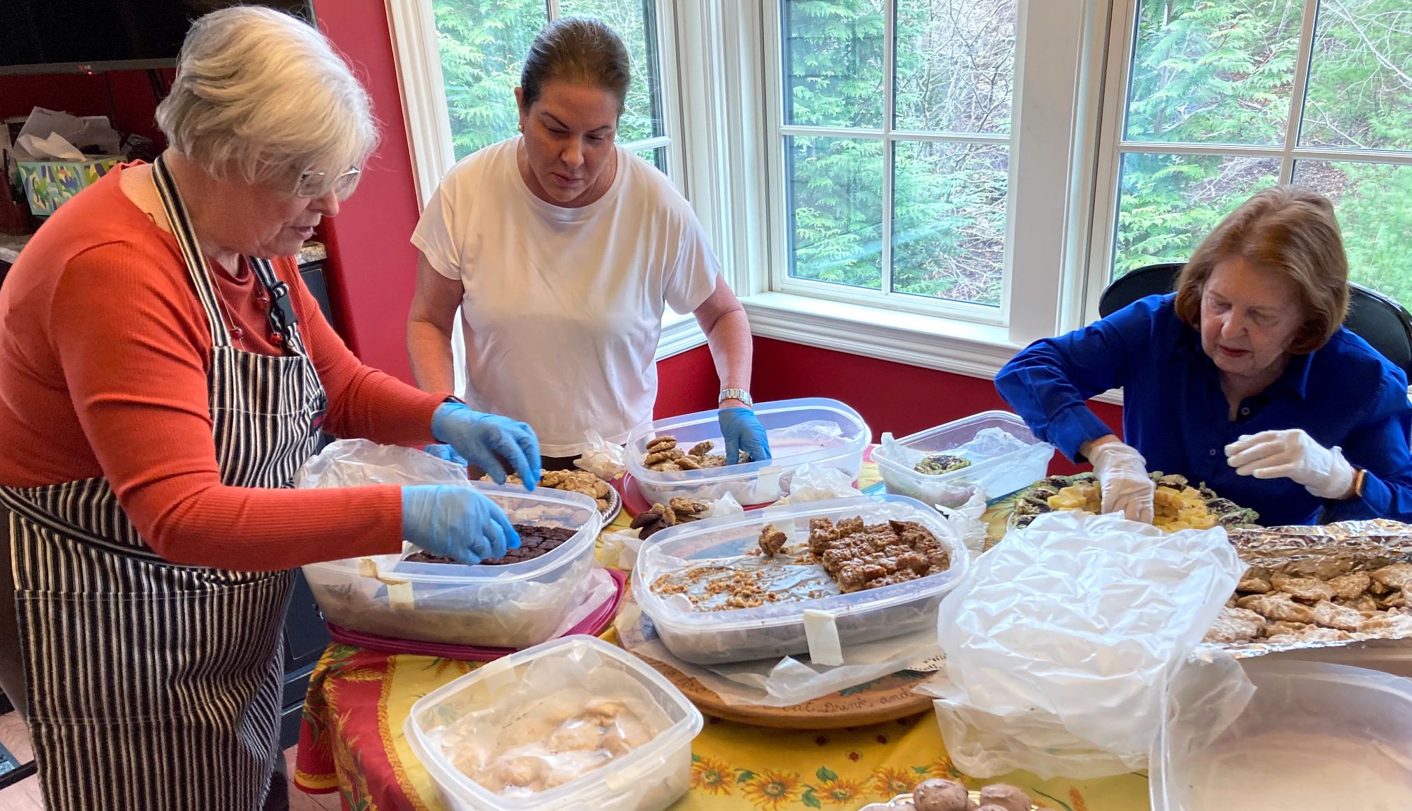 Barbara Beckerman and friends put various baked goods in tupperware