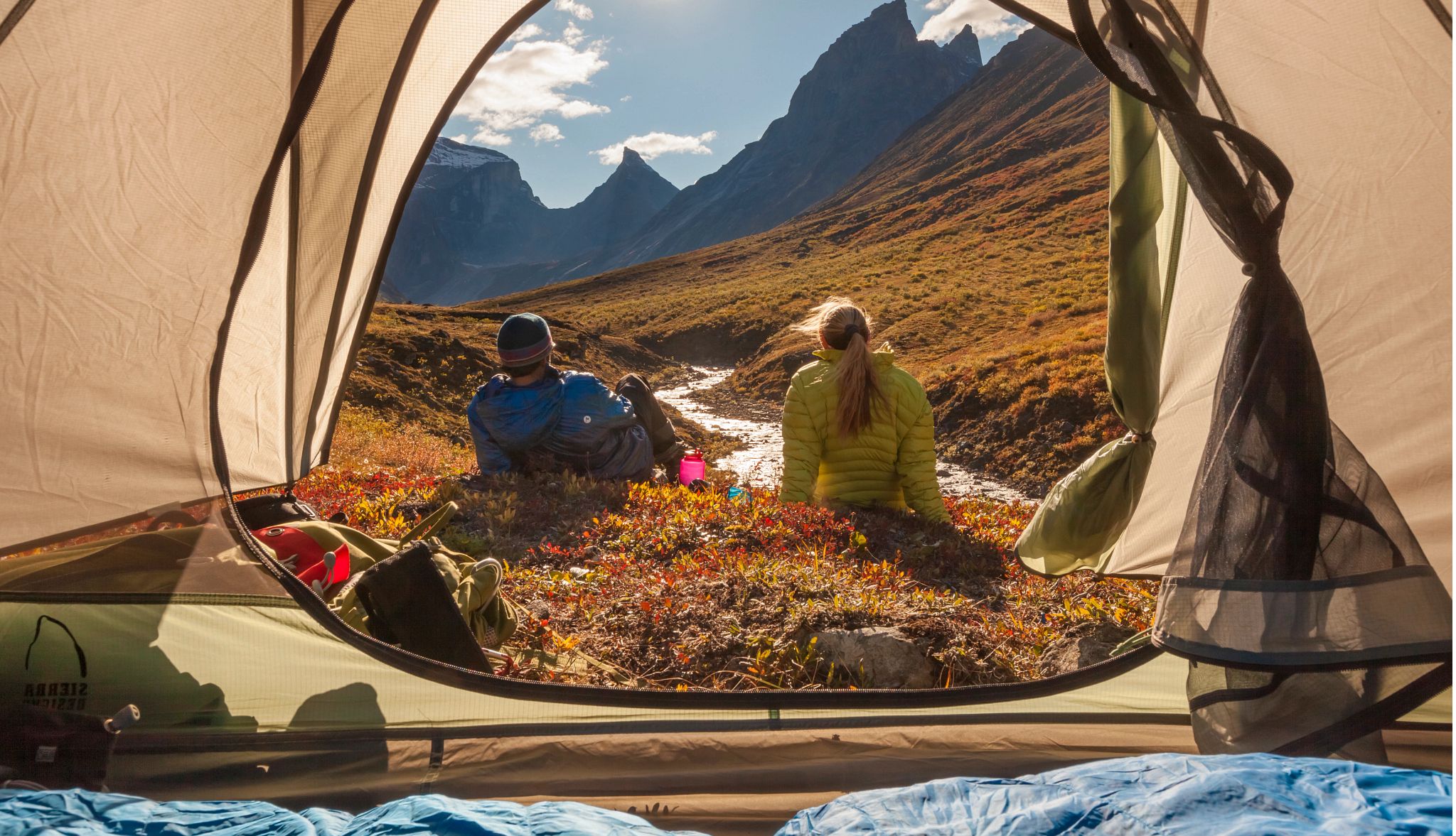 Smart Guide to Camping people sitting outside of a tent