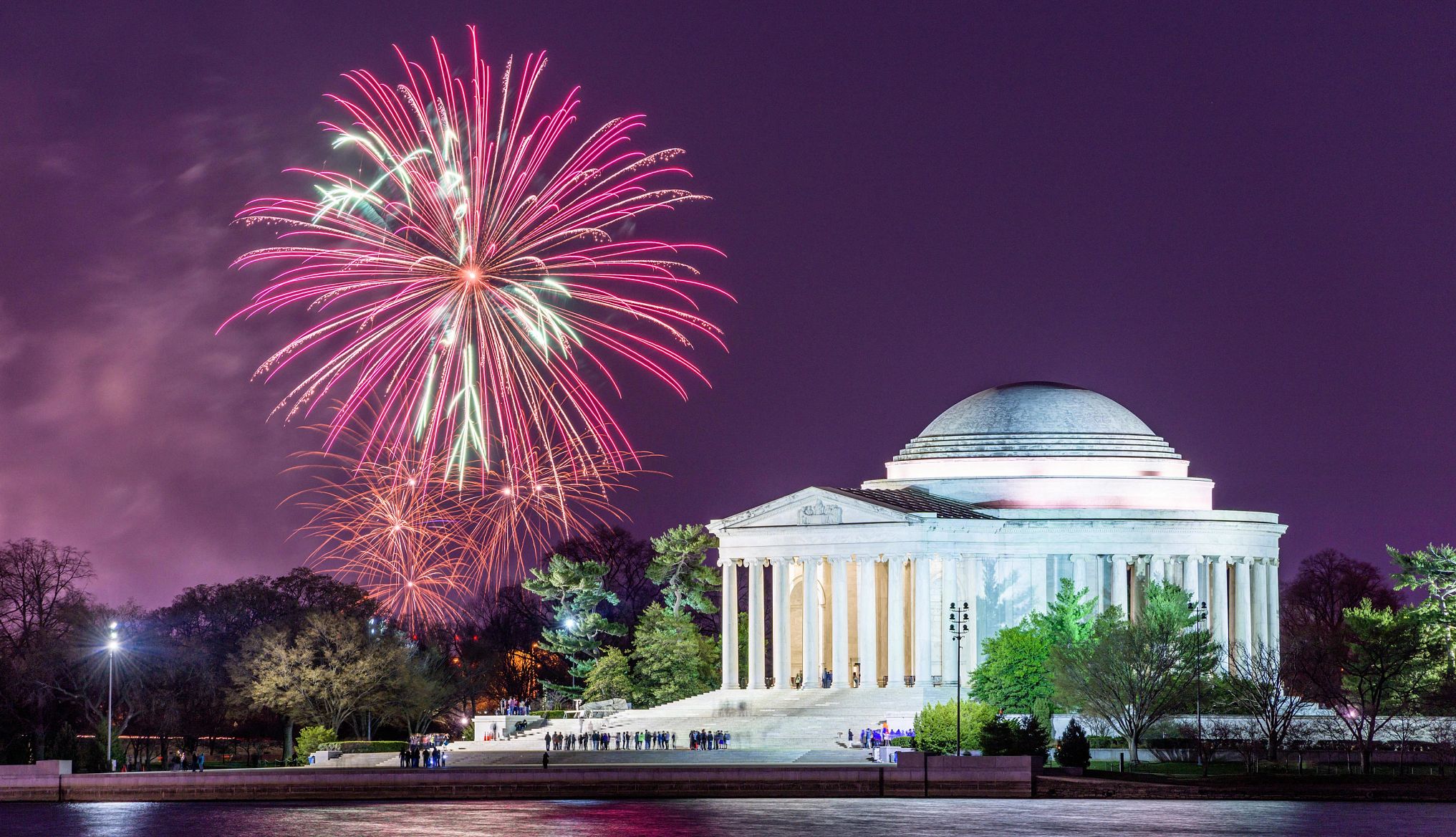 Affordable U.S. Destinations fireworks set off in the background of the jefferson memorial