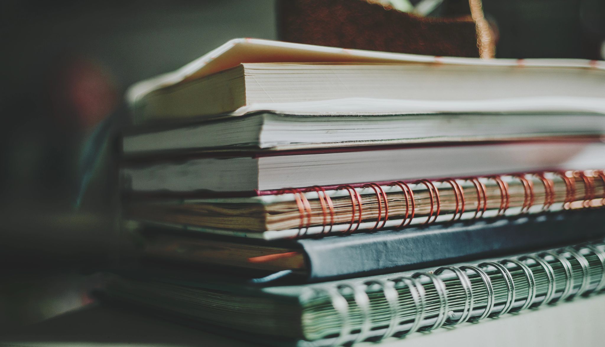 Old Journals, Unexpected Truths a stack of old notebooks and journals
