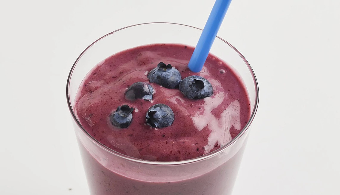 A close-up view of a berry-kefir smoothie in a glass