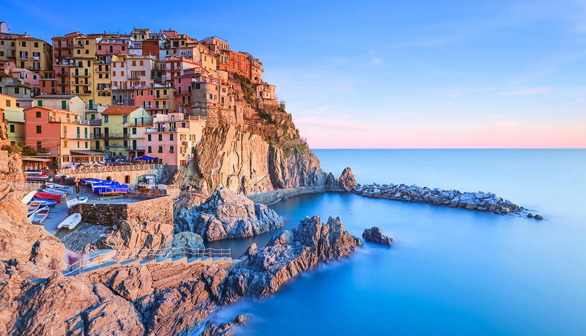 multi-color homes on cliff side by the ocean