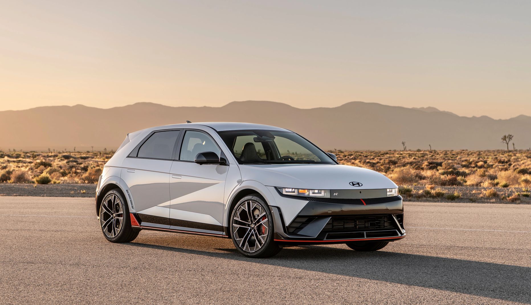 Hyundai Ioniq 5 N a gray four-door sedan slash compact s u v parked in the desert