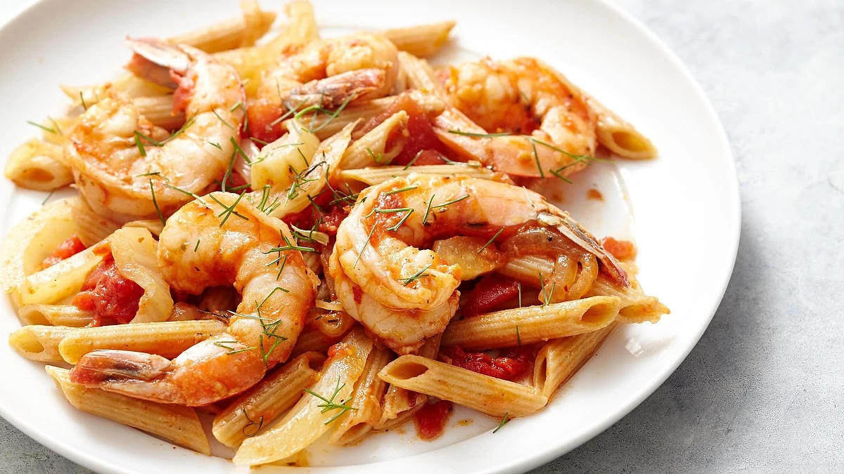 A close-up view of fennel and shrimp fra diavolo on a plate