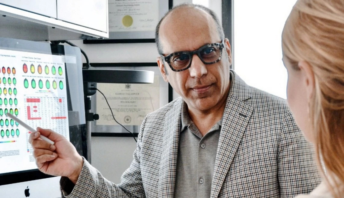 kamran fallahpour points to a screen