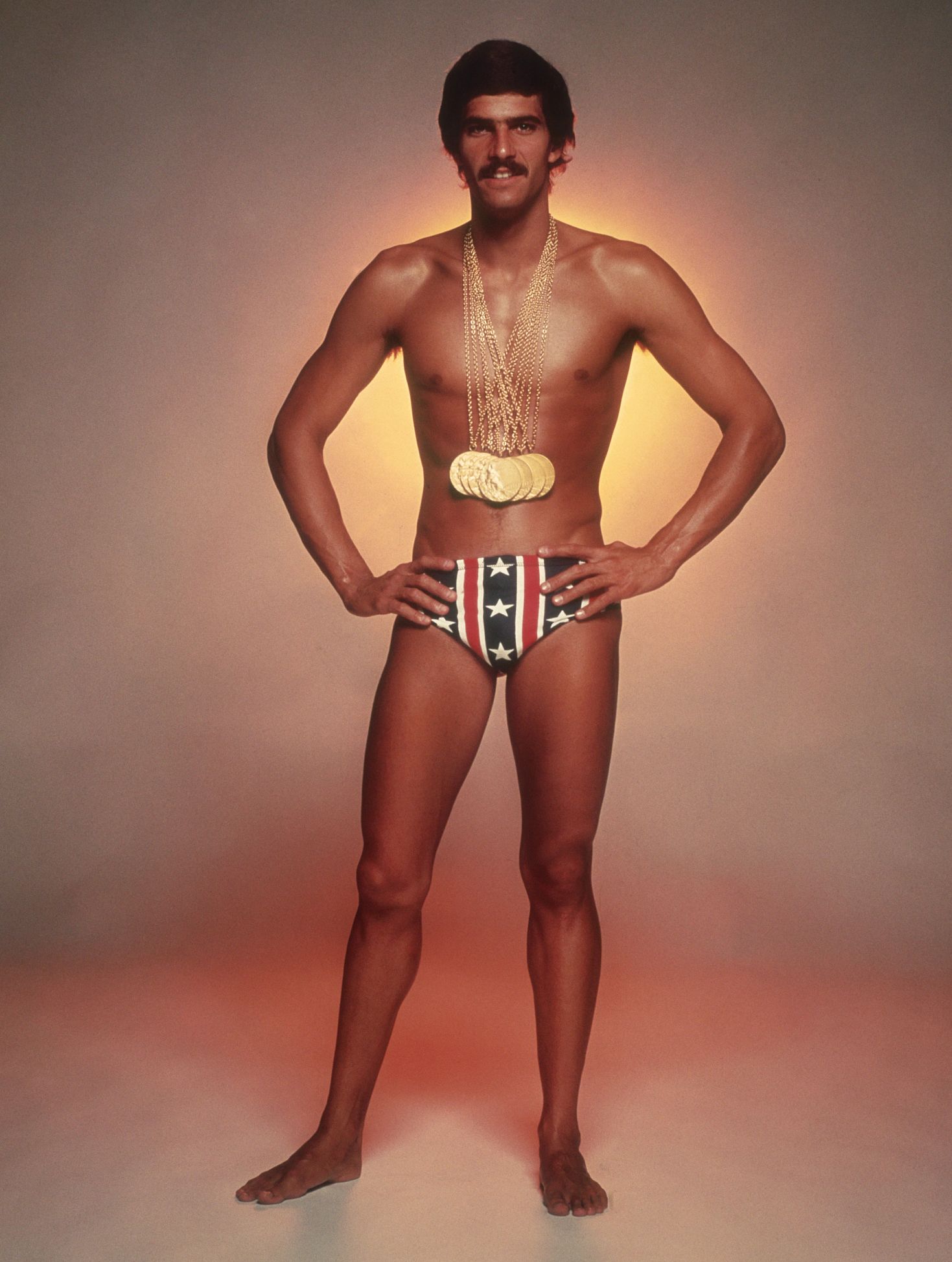 Spitz photographed a year after winning seven gold medals Young Mark Spitz in swimsuit wearing seven gold medals