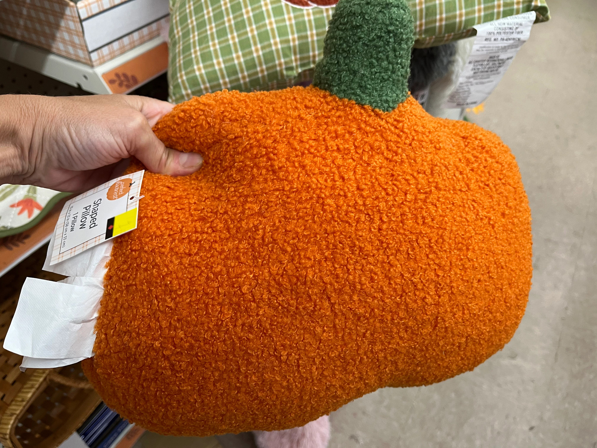 Halloween Decor on the Cheap  a photo shows a pumpkin shaped pillow