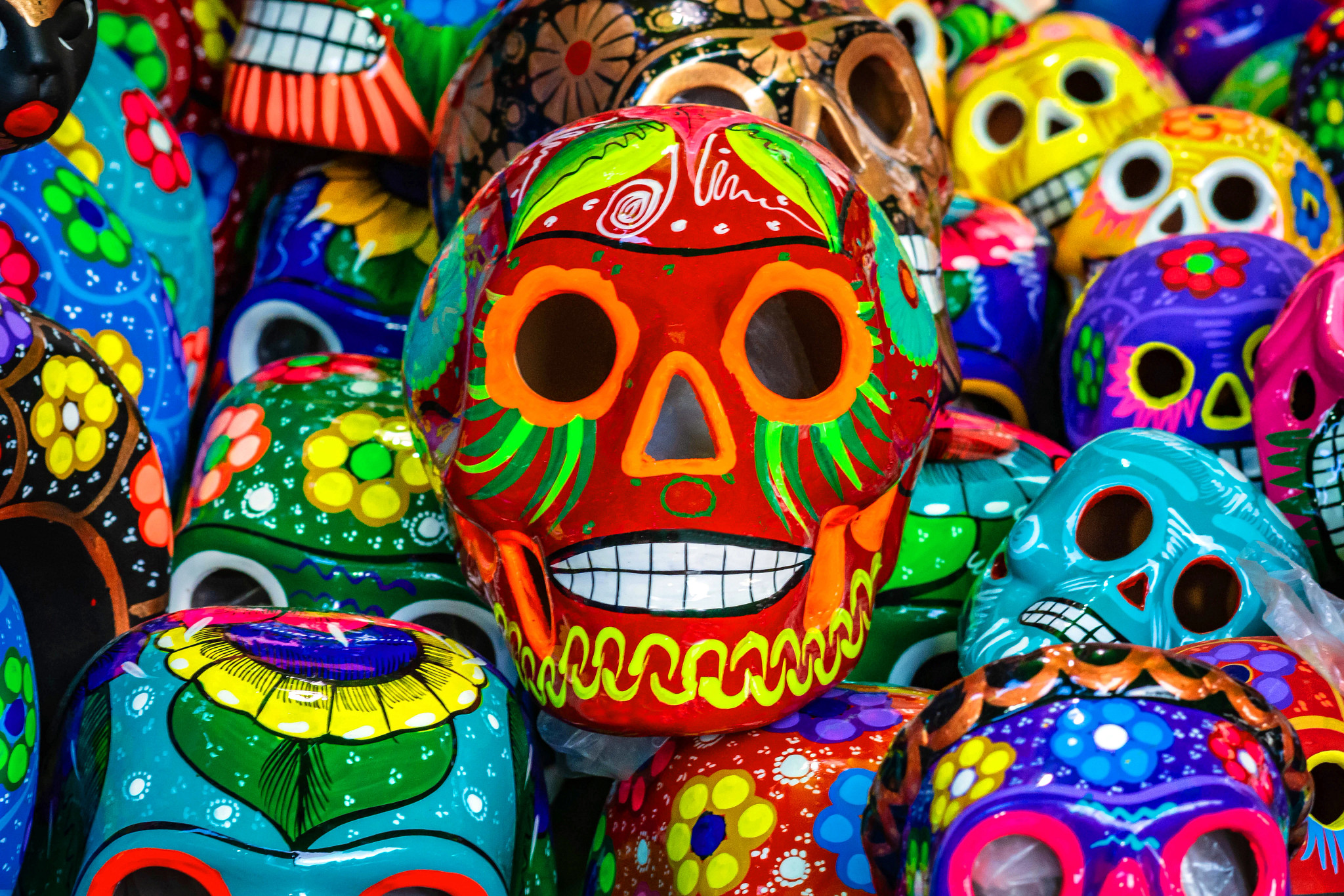Colorful calavera skulls stacked in celebration of Day of the Dead 