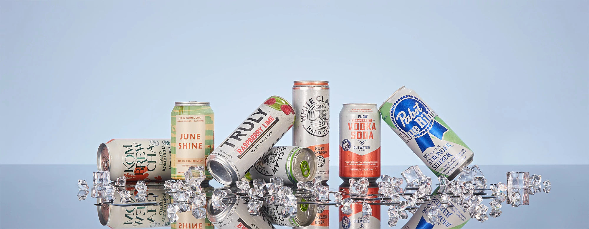 A group of hard seltzer cans on ice