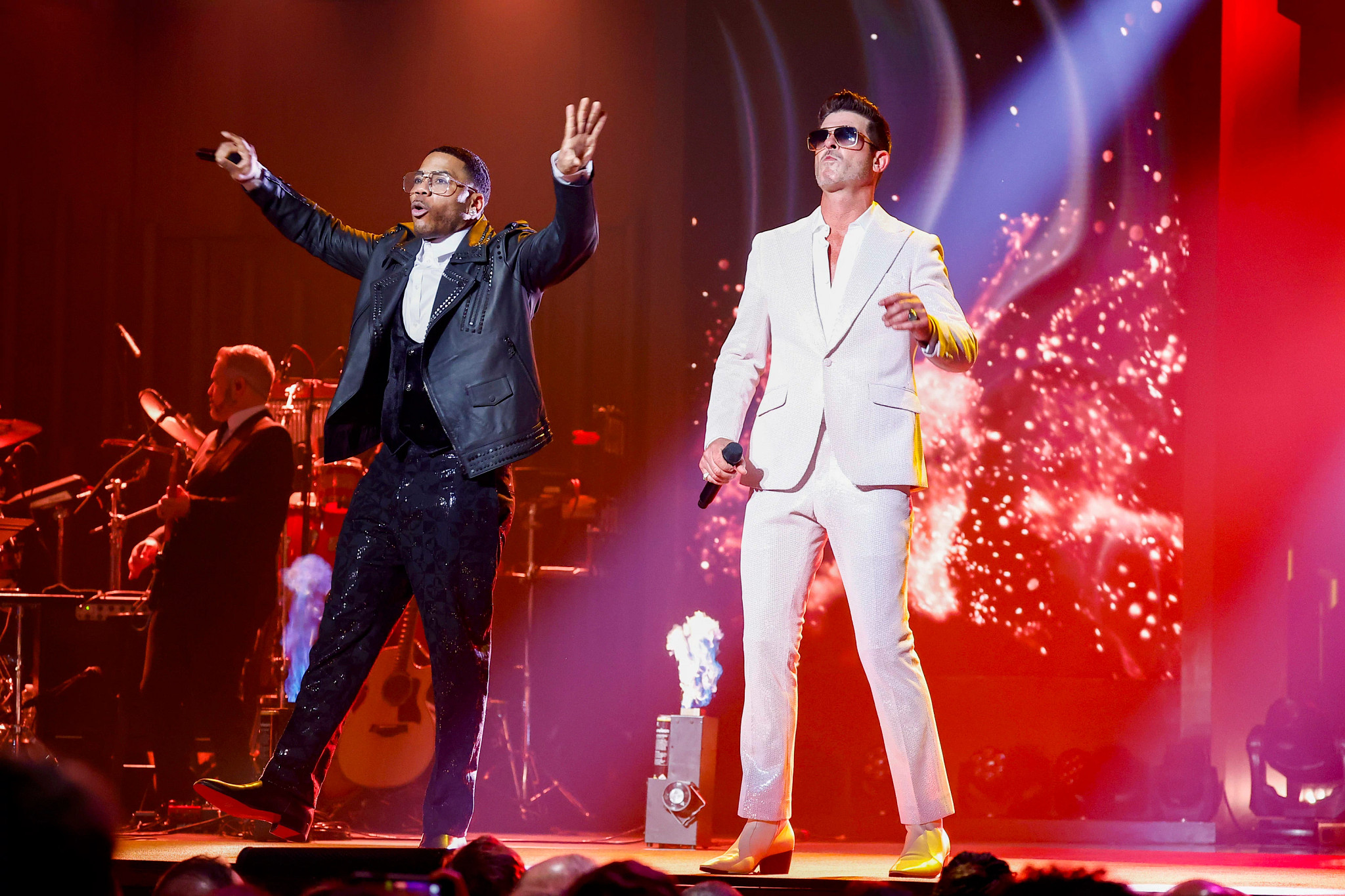 Nelly and Robin Thicke perform onstage during the 25th Annual Mark Twain Prize For American Humor