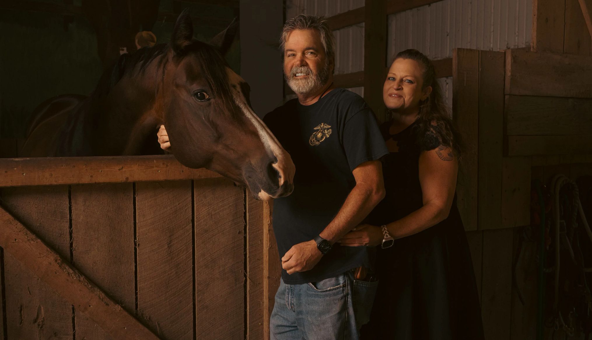 Caregivers Navigate Sensitive Conversations About Suicide With Care Recipients two people standing next to a horse