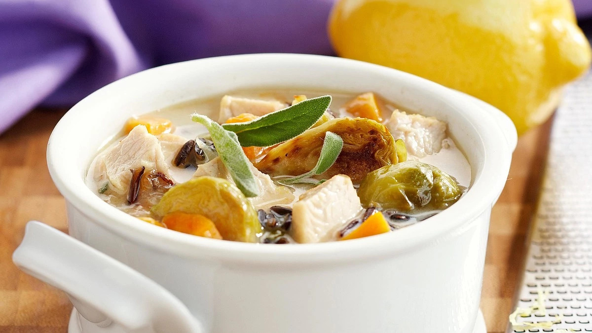 A close-up view of turkey wild rice soup in a bowl