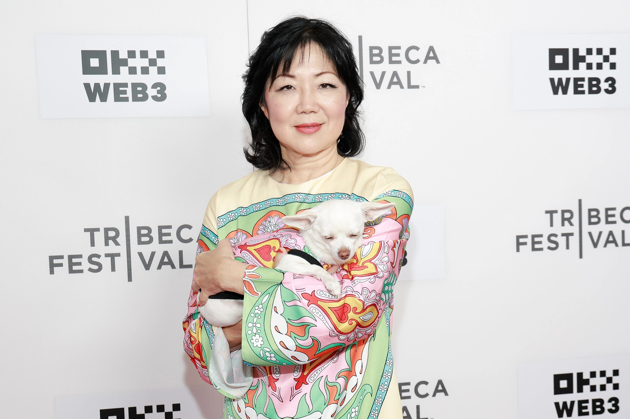 Margaret Cho holding a small dog as she attends the All That We Love premiere during the 2024 Tribeca Festival at SVA Theater on June 8, 2024 in New York City