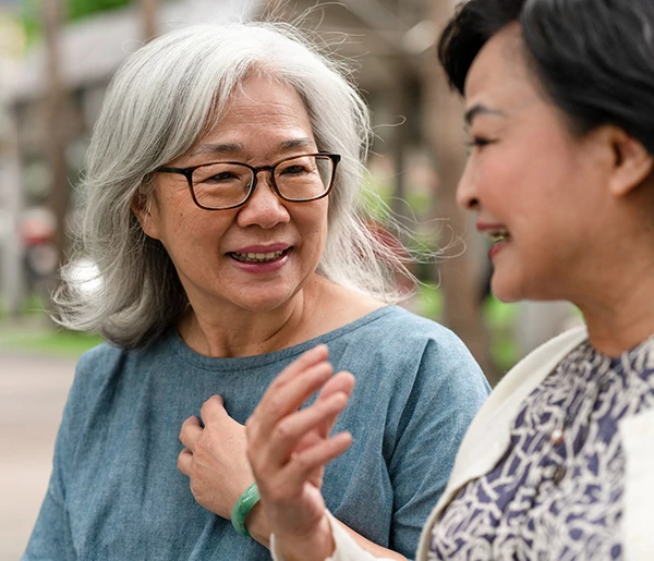 Two women engaged in conversation.