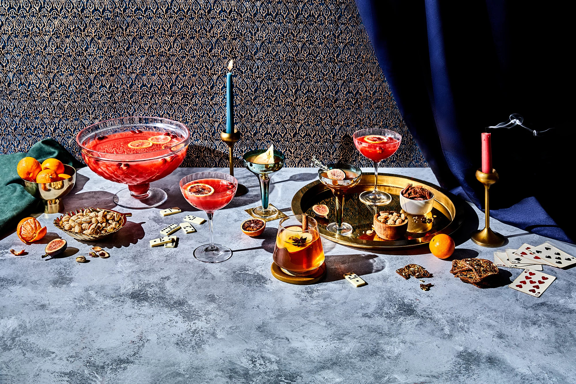 Holiday spread of cocktails and snacks on tabletop