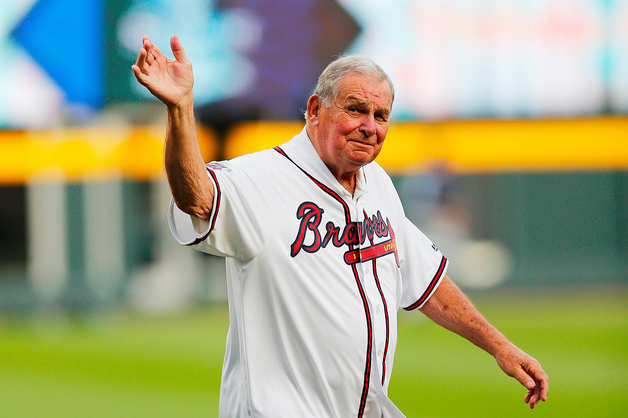 atlanta braves manager bobby cox in his uniform waves to the crowd