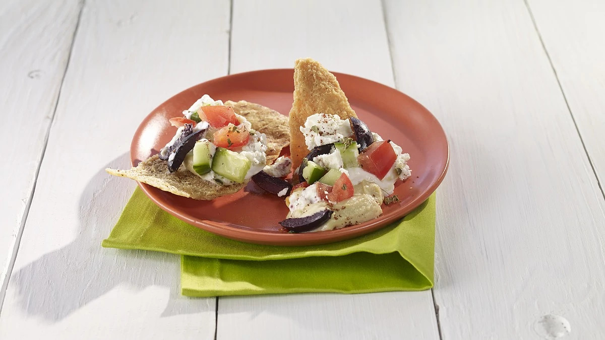 A close-up view of Middle Eastern layered dip on a plate