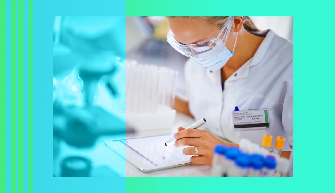 Brain Disease Database researcher working on tablet in a lab
