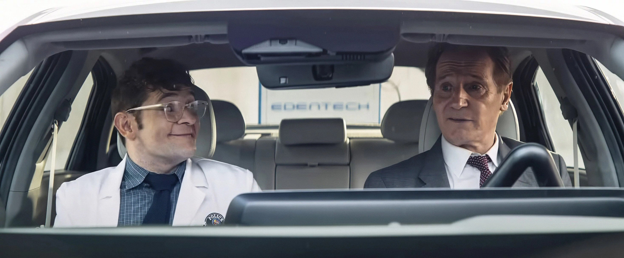 chase anderson and liam neeson in a scene from the naked gun