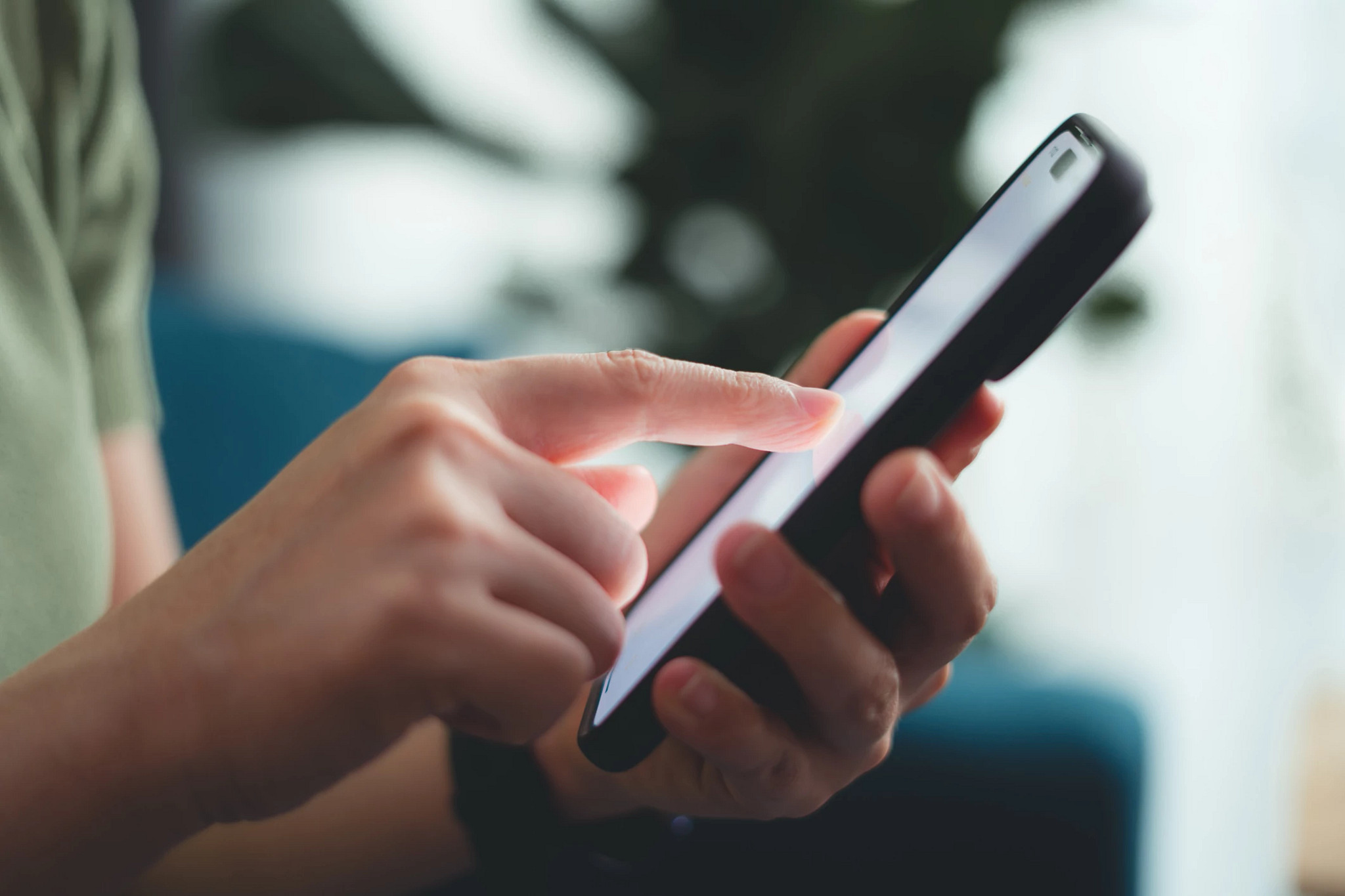 hand touching a phone screen