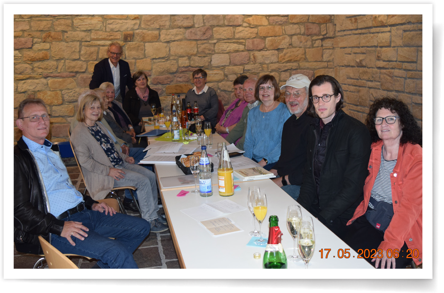 Debra Wolfe sitting at a table with her relatives
