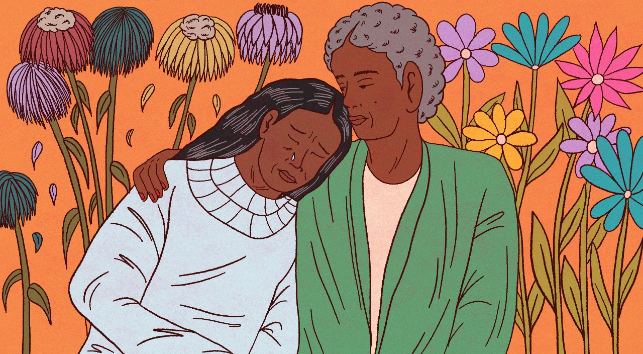 Two women giving each other a side hug, comforting or encouraging each other