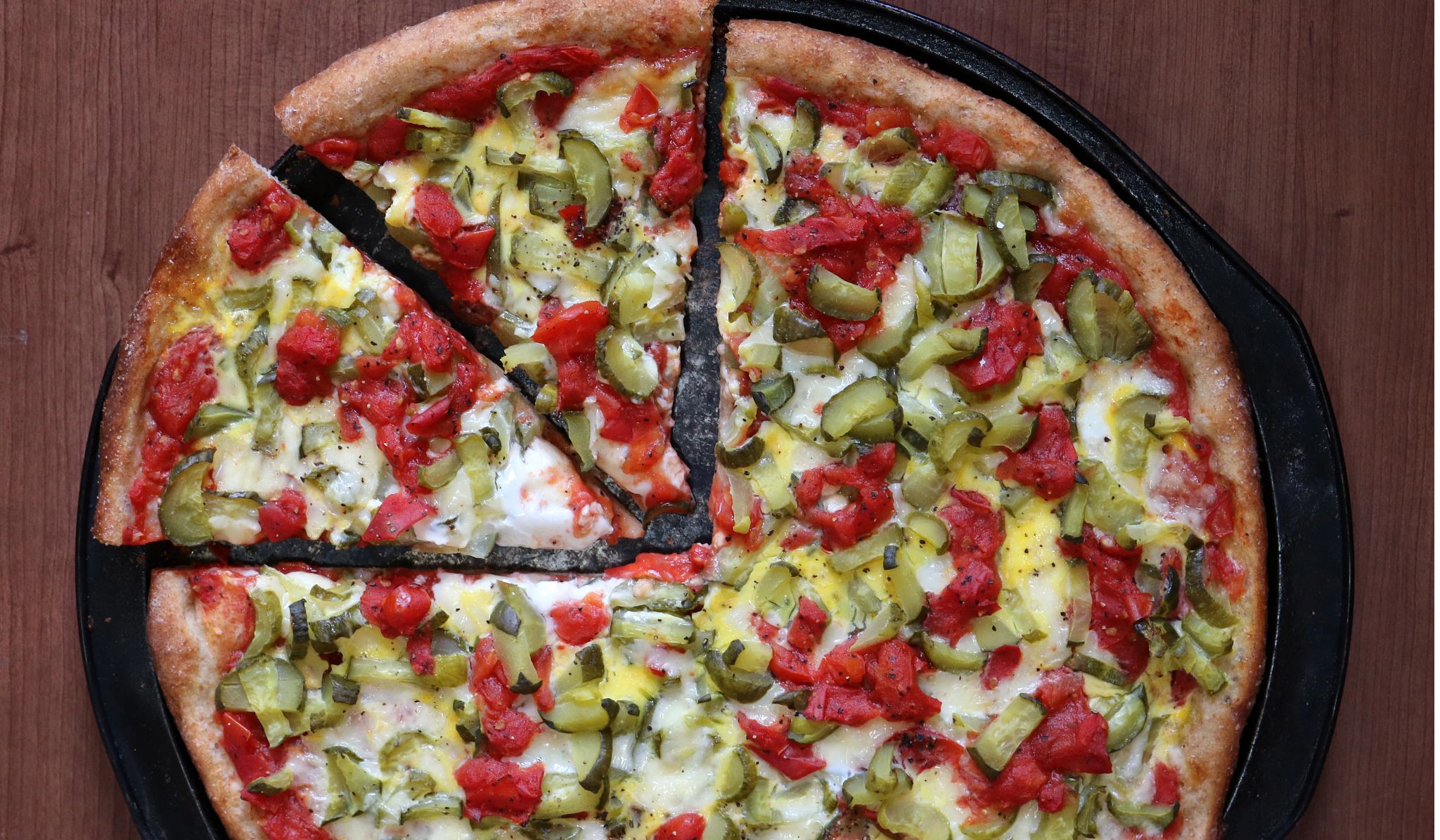 Homemade healthy delicious vegetarian pizza made from 100% Whole Wheet Flour filled with tomatoes, pickles, cheese & eggs. Tastes super good. Homemade healthy delicious vegetarian pizza made from 100% Whole Wheet Flour filled with tomatoes, pickles, cheese & eggs. Tastes super good.