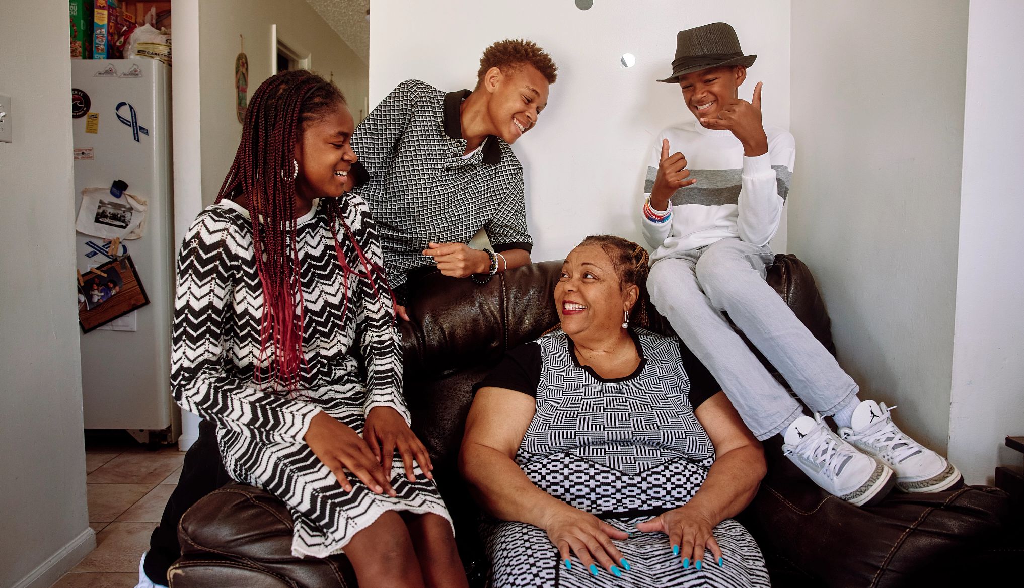 Could Your Grandkids Be Getting Social Security? a family of four sitting in a living room