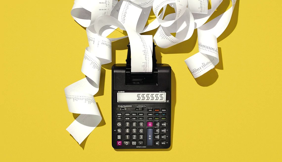 a calculator with paper coming out the top on a yellow background