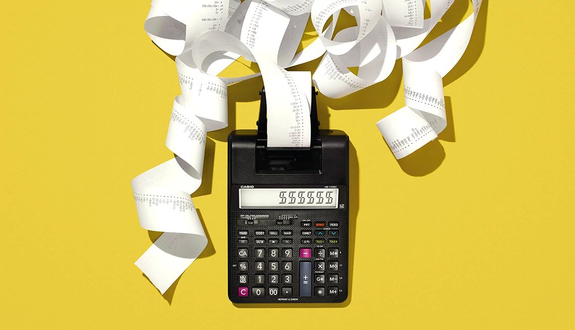 a calculator with paper coming out the top on a yellow background a calculator with paper coming out the top on a yellow background