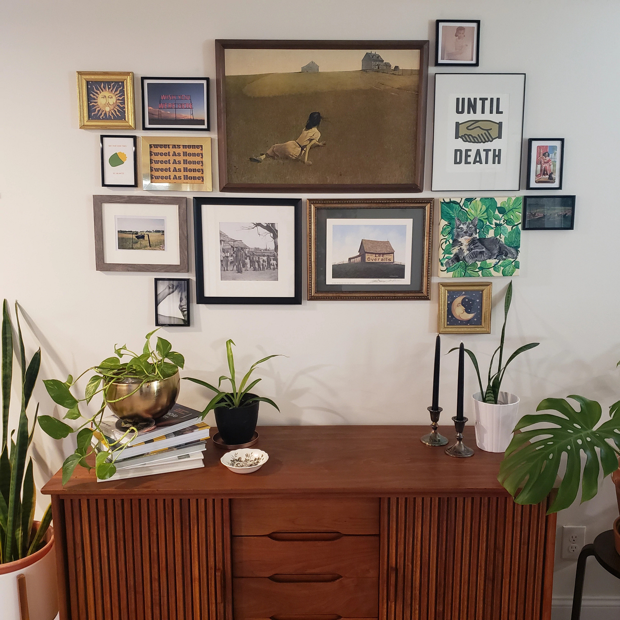 image of gallery wall of photos and artwork in living room