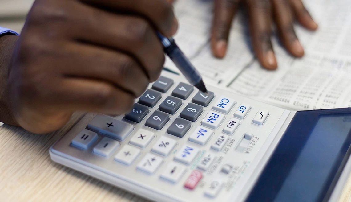 Hands using calculator Hands using calculator