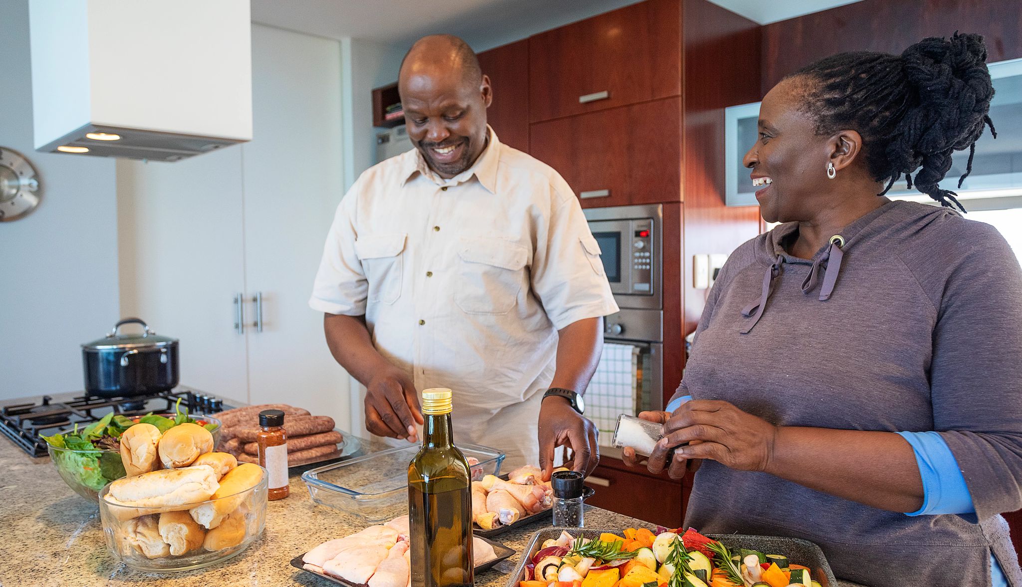Senior African Couple Having Fun Cooking Together Senior African Couple Having Fun Cooking Together