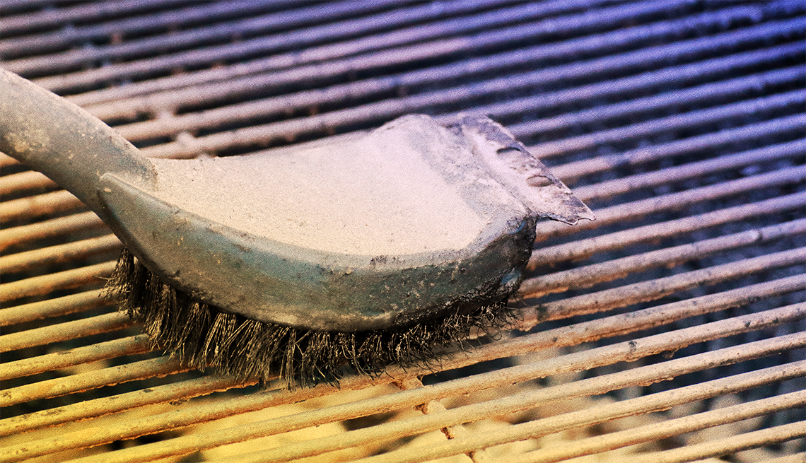 grill brush scraping a grill
