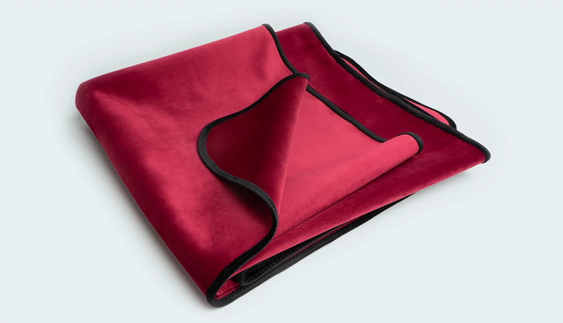 a red sex blanket on a teal background