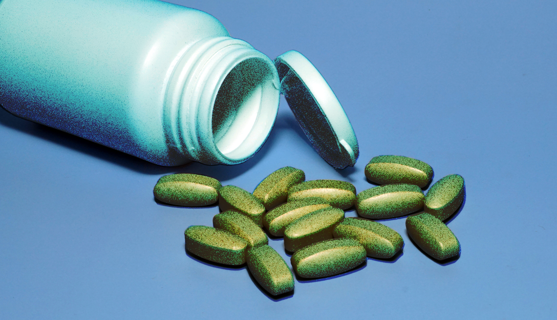 Fake Supplement and Vitamin Scams a pill bottle spilling over