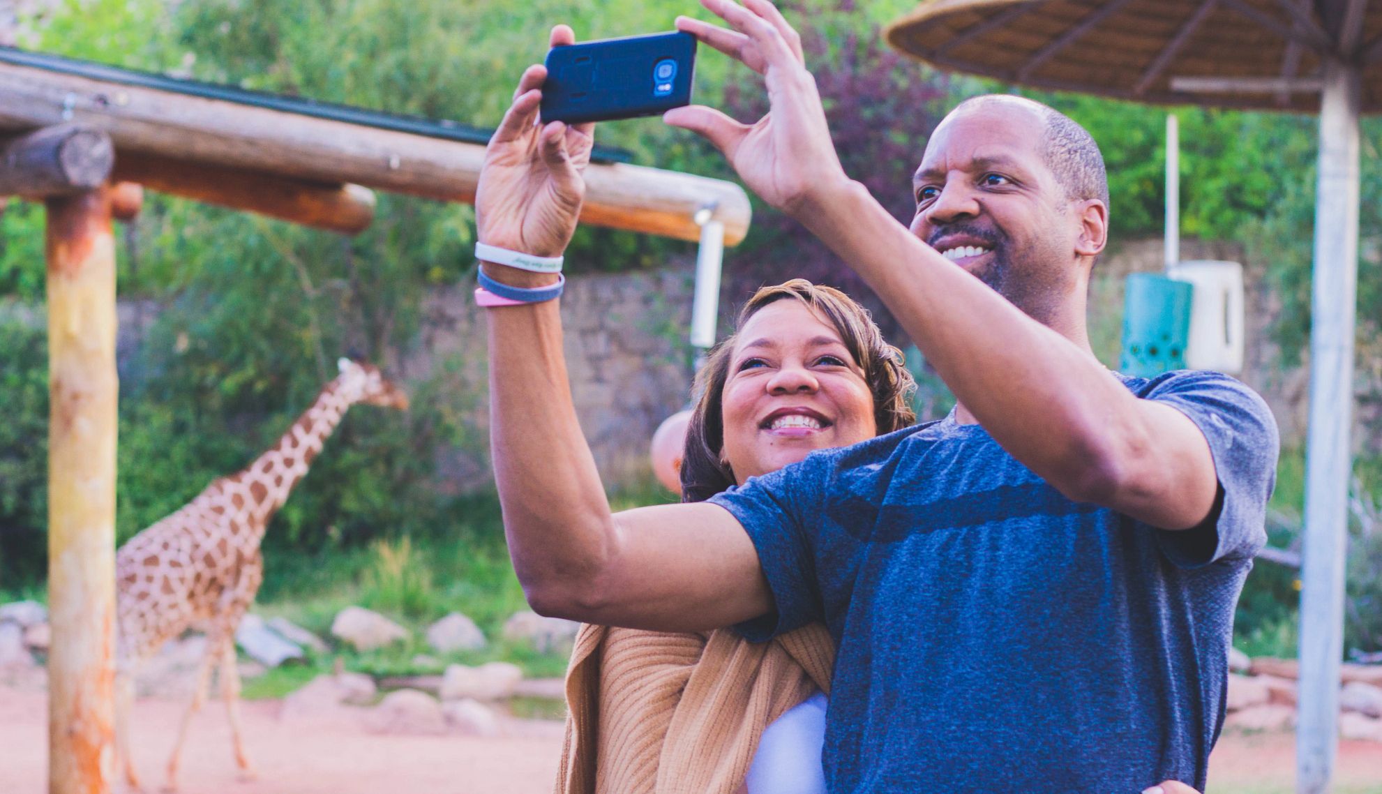 Late Night at the Zoo Events for Adults a man and woman take a picture at a zoo